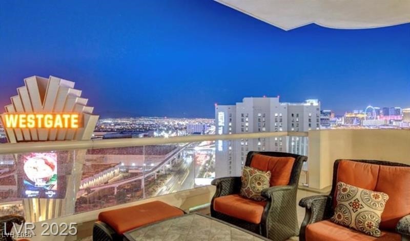 2857 Paradise Road, Unit 2103 Las Vegas, NV 89109 - Photo 47 of 55 Balcony at night featuring a view of city lights