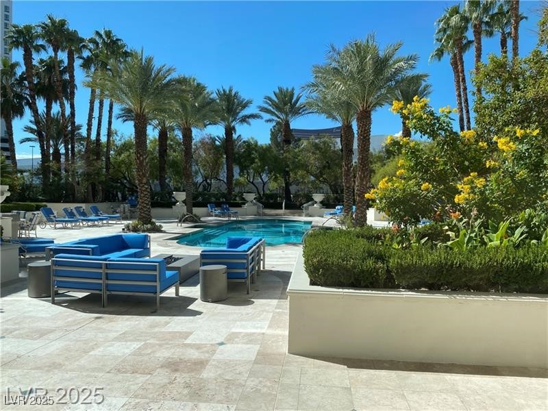 2857 Paradise Road, Unit 2103 Las Vegas, NV 89109 - Photo 51 of 55 Community pool featuring a patio area