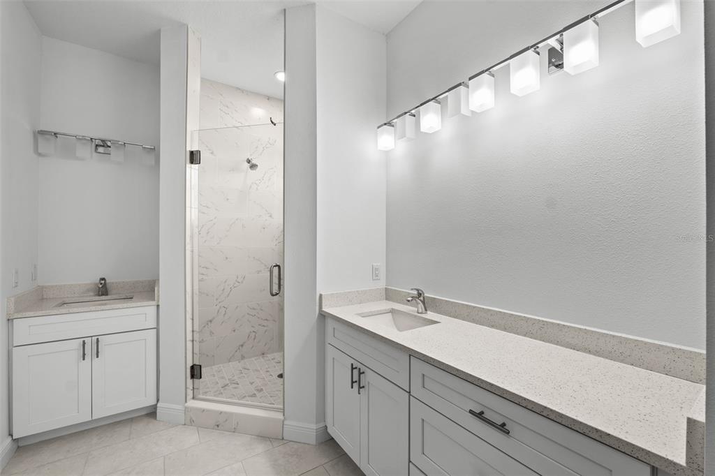 5732 Biscayne Court, Unit 1 New Port Richey, FL 34652 - Photo 16 of 48 a bathroom with a sink and a mirror