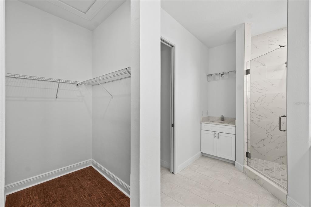 5732 Biscayne Court, Unit 1 New Port Richey, FL 34652 - Photo 18 of 48 a bathroom with a shower and a sink