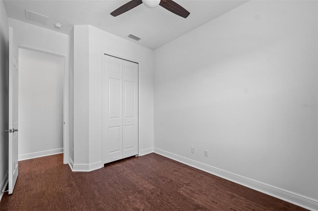 5732 Biscayne Court, Unit 1 New Port Richey, FL 34652 - Photo 20 of 48 wooden floor in an empty room