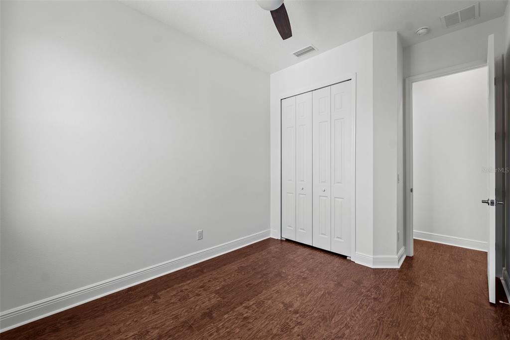 5732 Biscayne Court, Unit 1 New Port Richey, FL 34652 - Photo 23 of 48 wooden floor in an empty room