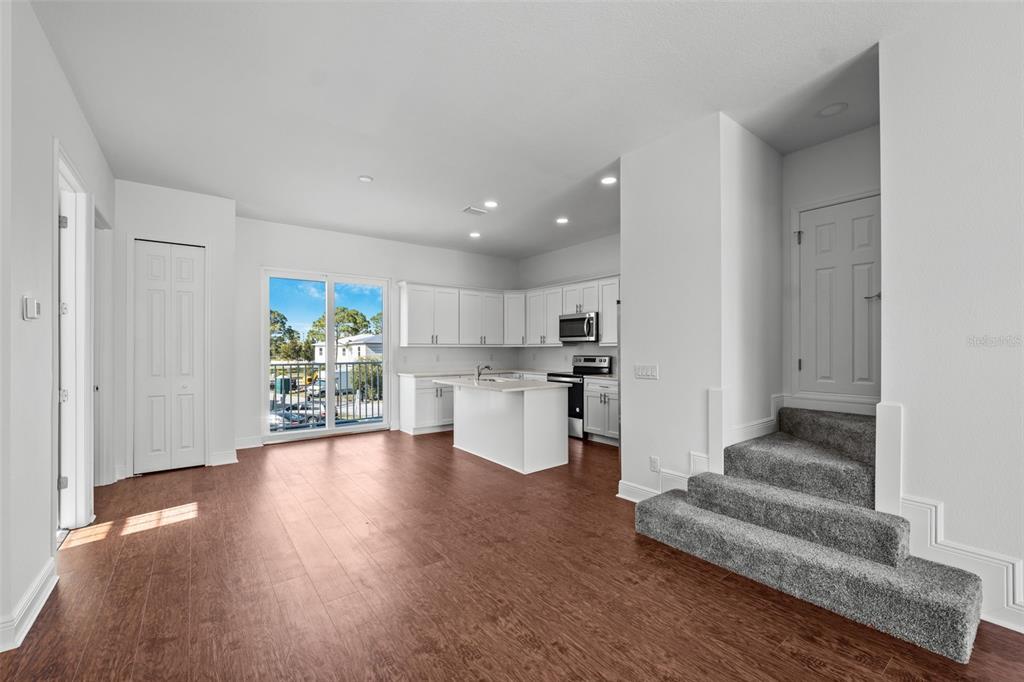 5732 Biscayne Court, Unit 1 New Port Richey, FL 34652 - Photo 3 of 48 a view of kitchen with furniture and wooden floor