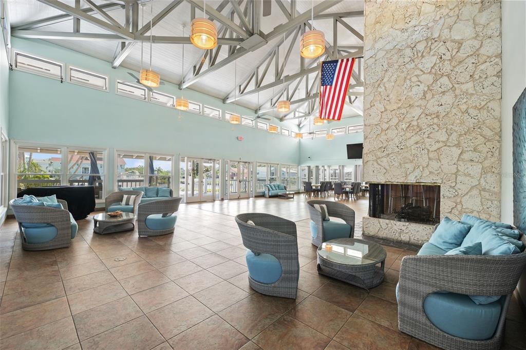 5732 Biscayne Court, Unit 1 New Port Richey, FL 34652 - Photo 33 of 48 a living room with furniture and a fireplace