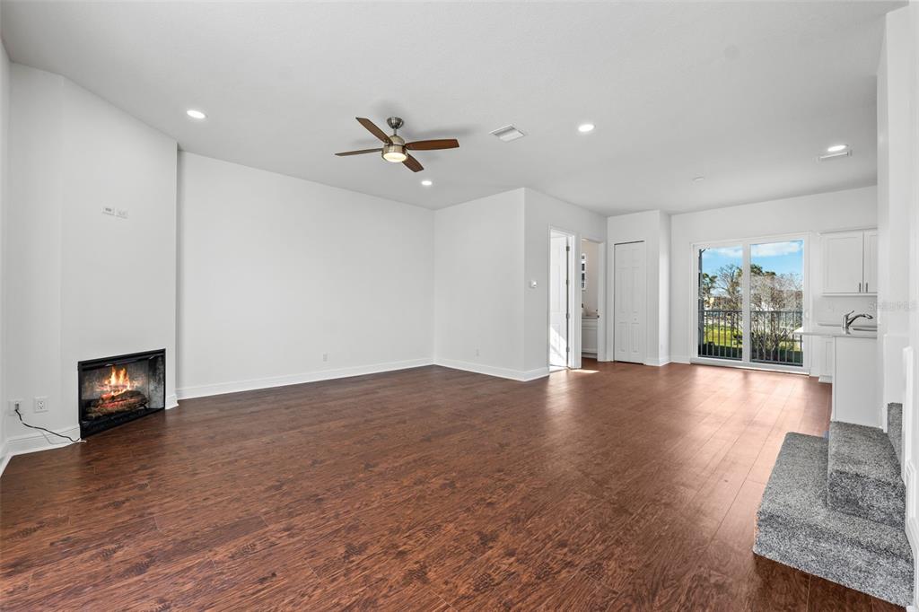 5732 Biscayne Court, Unit 1 New Port Richey, FL 34652 - Photo 4 of 48 a view of an empty room with wooden floor and a window