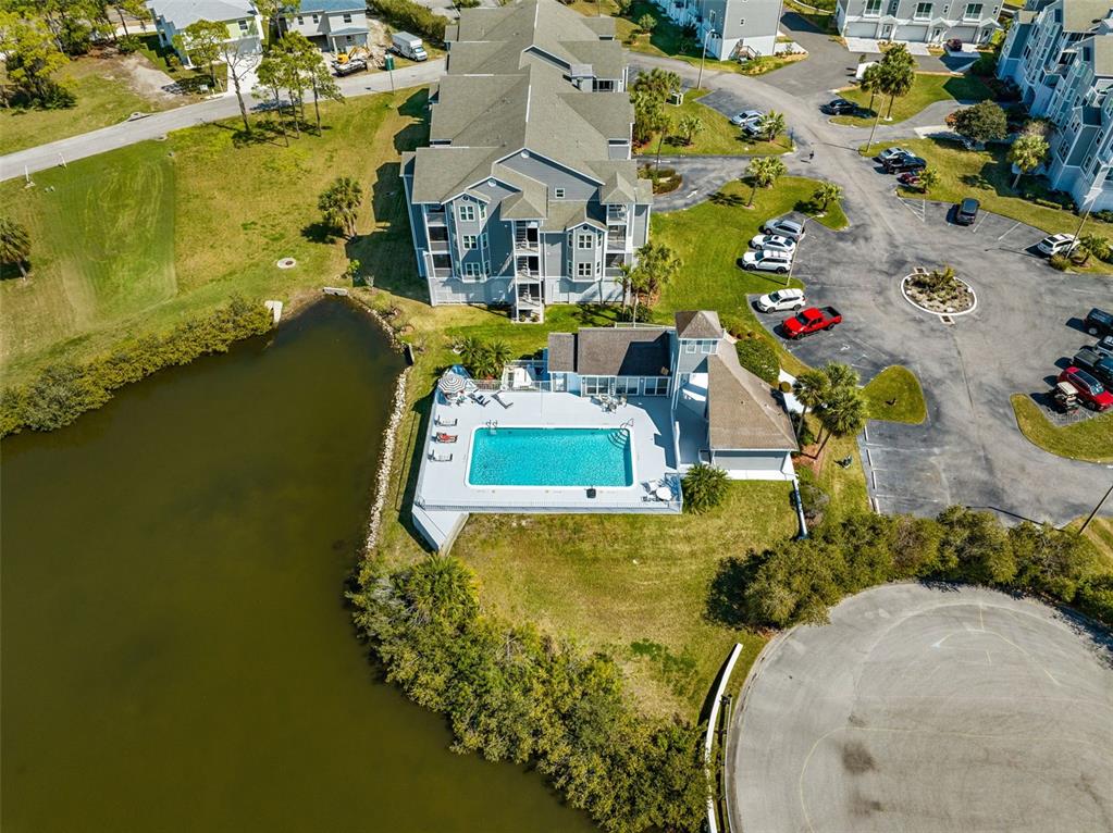 5732 Biscayne Court, Unit 1 New Port Richey, FL 34652 - Photo 43 of 48 an aerial view of a house with a swimming pool