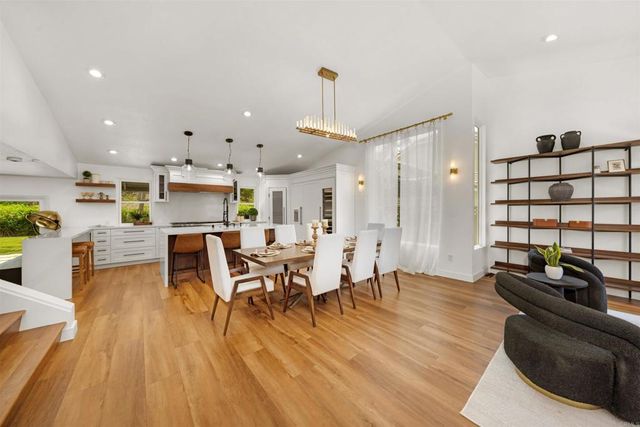 a view of a dining room furniture and wooden floor