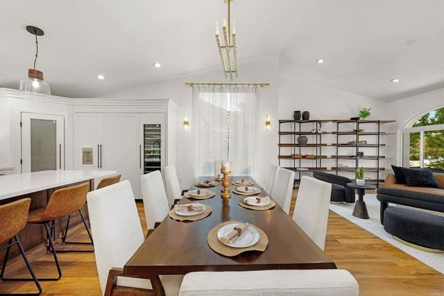a view of a dining room and livingroom with furniture