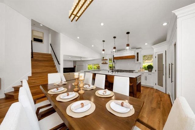 a living room with furniture potted plant and a fireplace