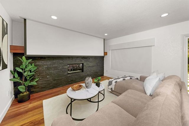 a room with furniture and a wooden floor