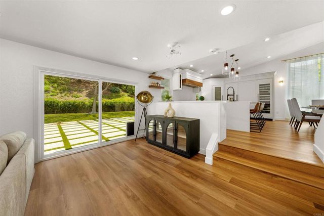 a spacious bathroom with a double vanity sink a mirror and a bathtub
