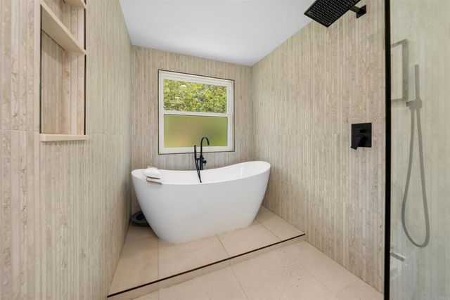 a bedroom with a bed and a view of bedroom