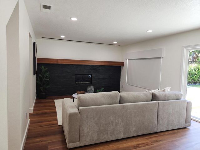 a living room with furniture and a rug
