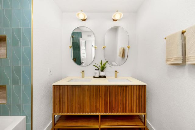 a bedroom with a large bed and a large window