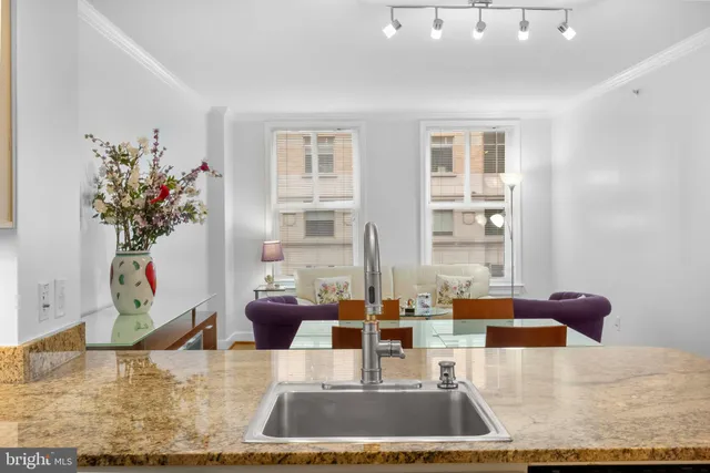 a view of living room with furniture and a potted plant