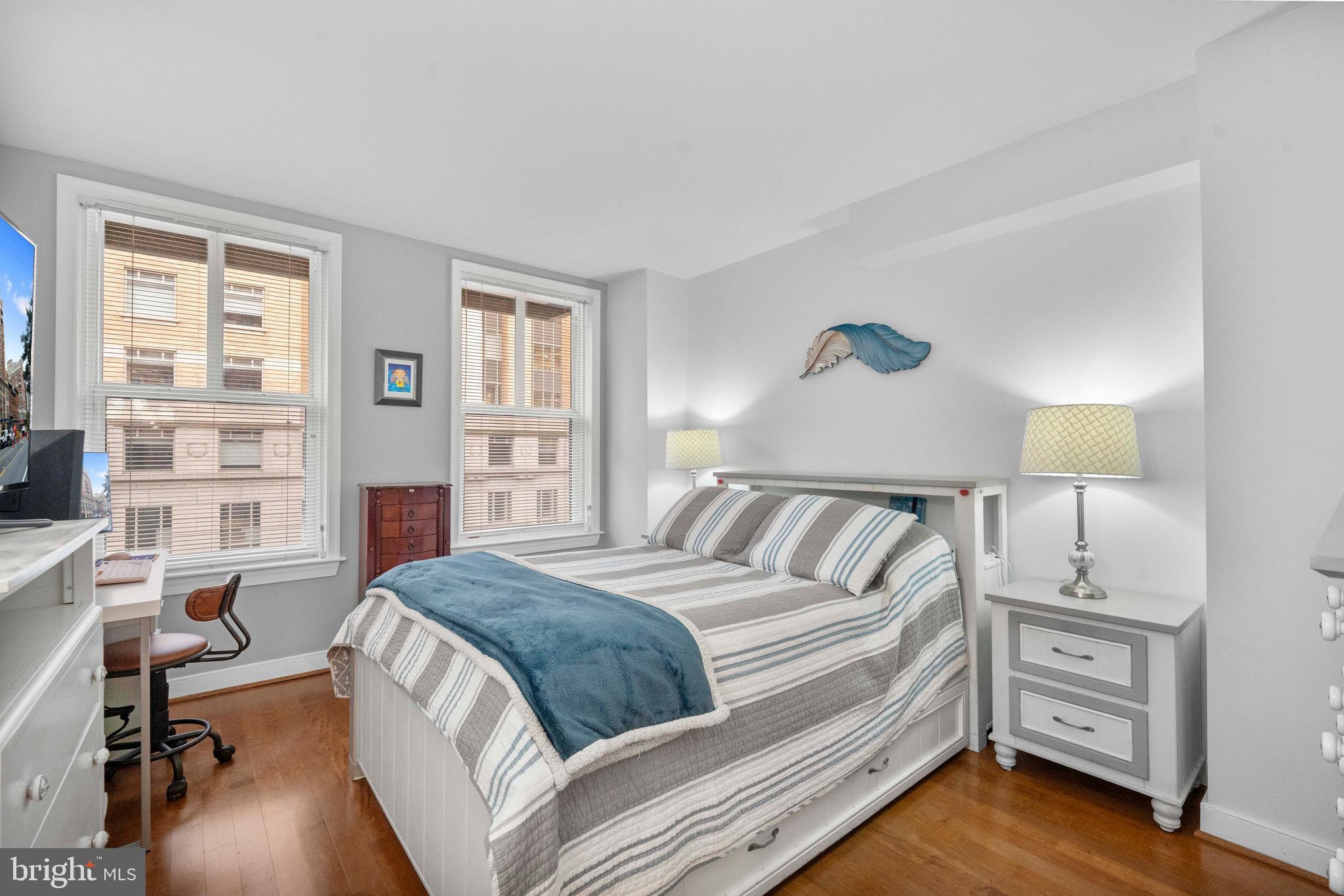 616 E Street Northwest, Unit 522 Washington, DC 20004 - Photo 17 of 43 a spacious bedroom with a bed and a desk