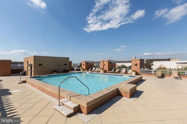 a lobby with a table and chairs