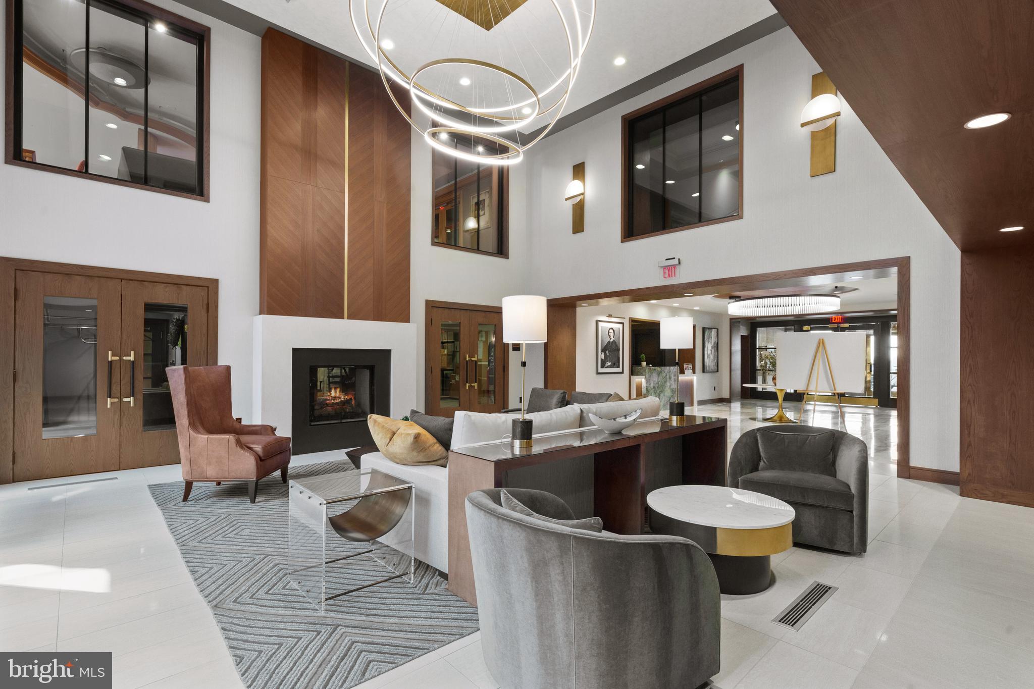 616 E Street Northwest, Unit 522 Washington, DC 20004 - Photo 28 of 43 a living room with fireplace furniture and a large window