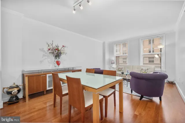 a view of a dining room with furniture window and wooden floor
