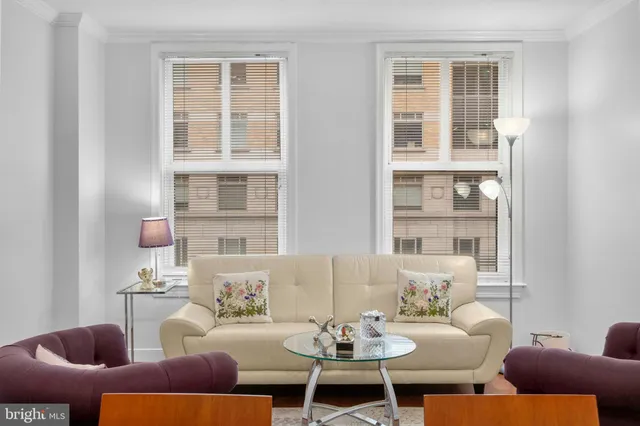 a living room with furniture and windows