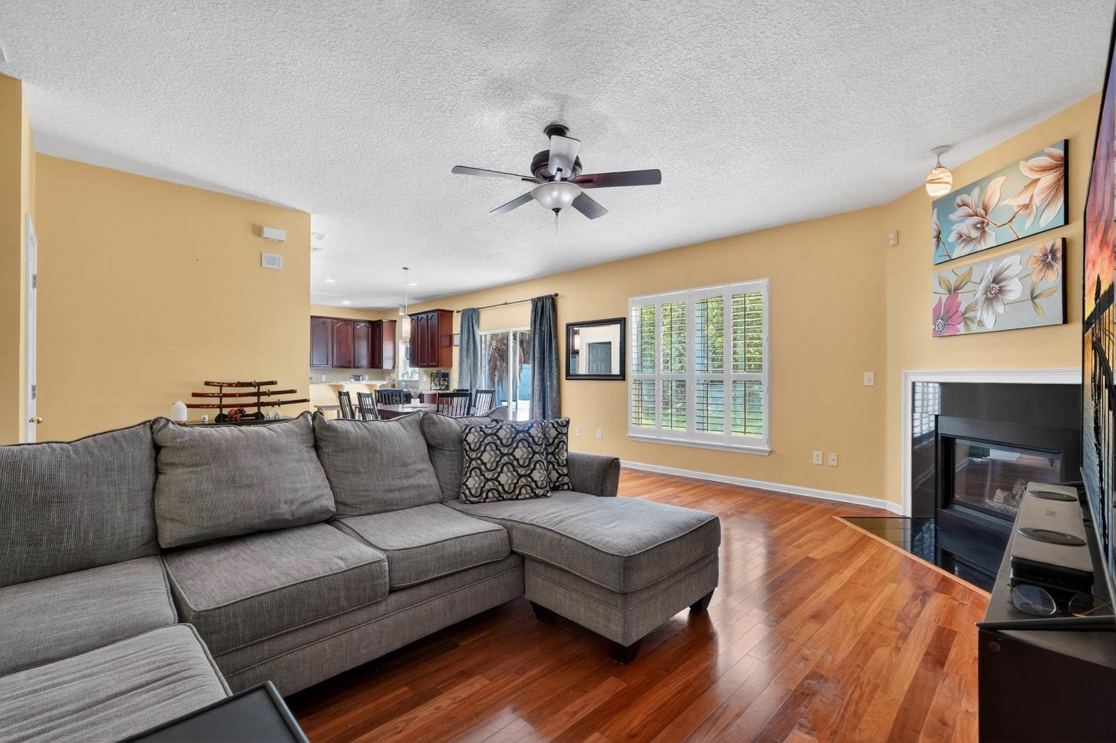 1237 Splendid Ravine Street St. Augustine, FL 32092 - Photo 9 of 62 a living room with furniture and a fireplace