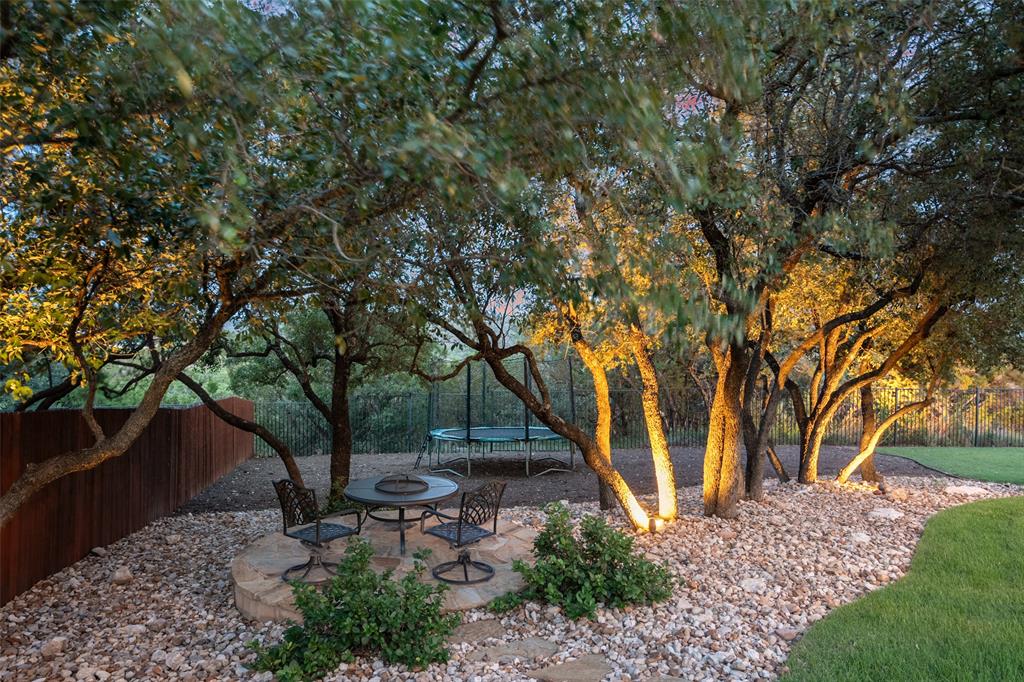 732 SANTALUZ Path Austin, TX 78732 - Photo 11 of 40 a backyard of a house with table and chairs