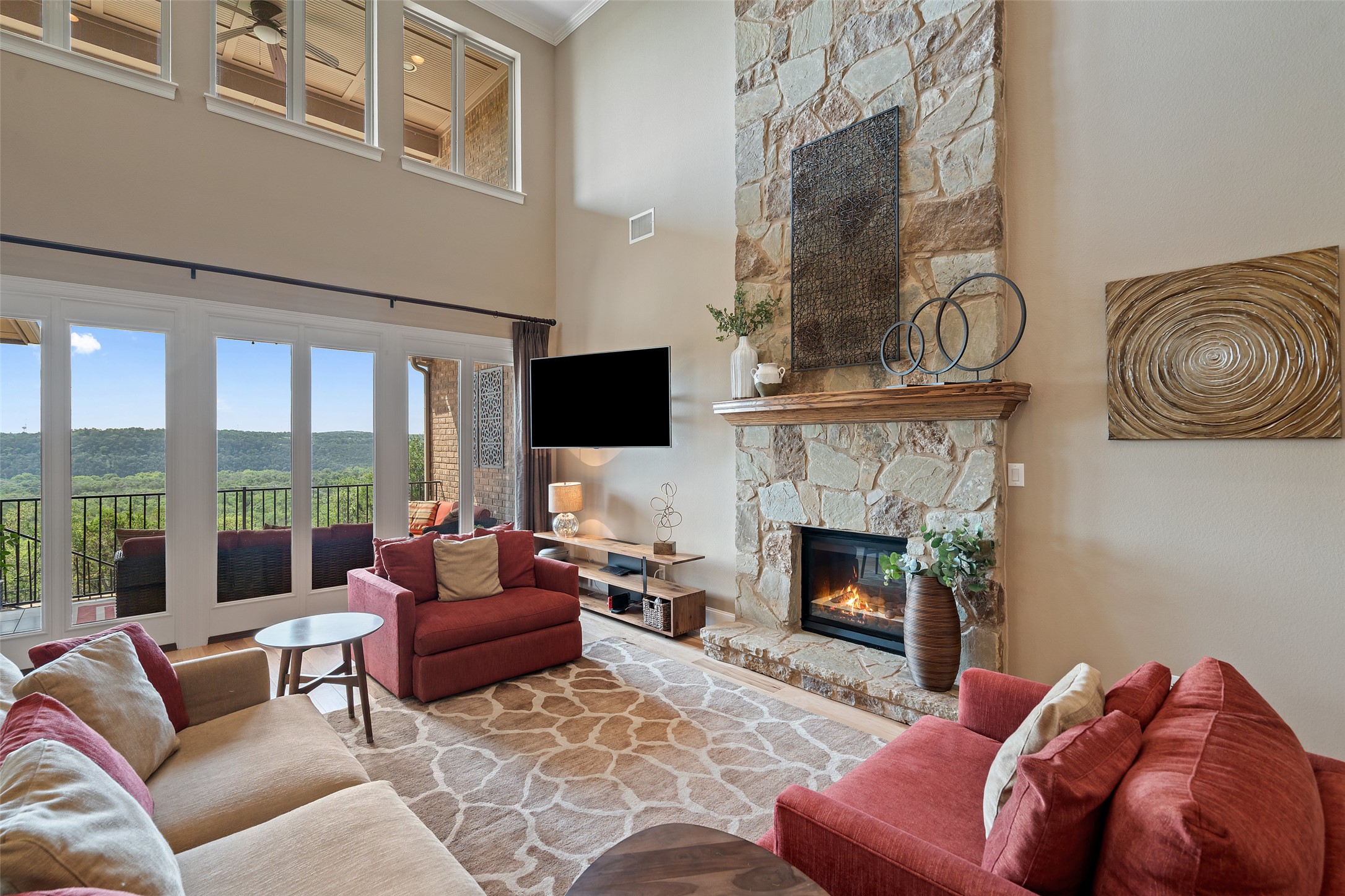 732 SANTALUZ Path Austin, TX 78732 - Photo 13 of 40 a living room with furniture and a fireplace