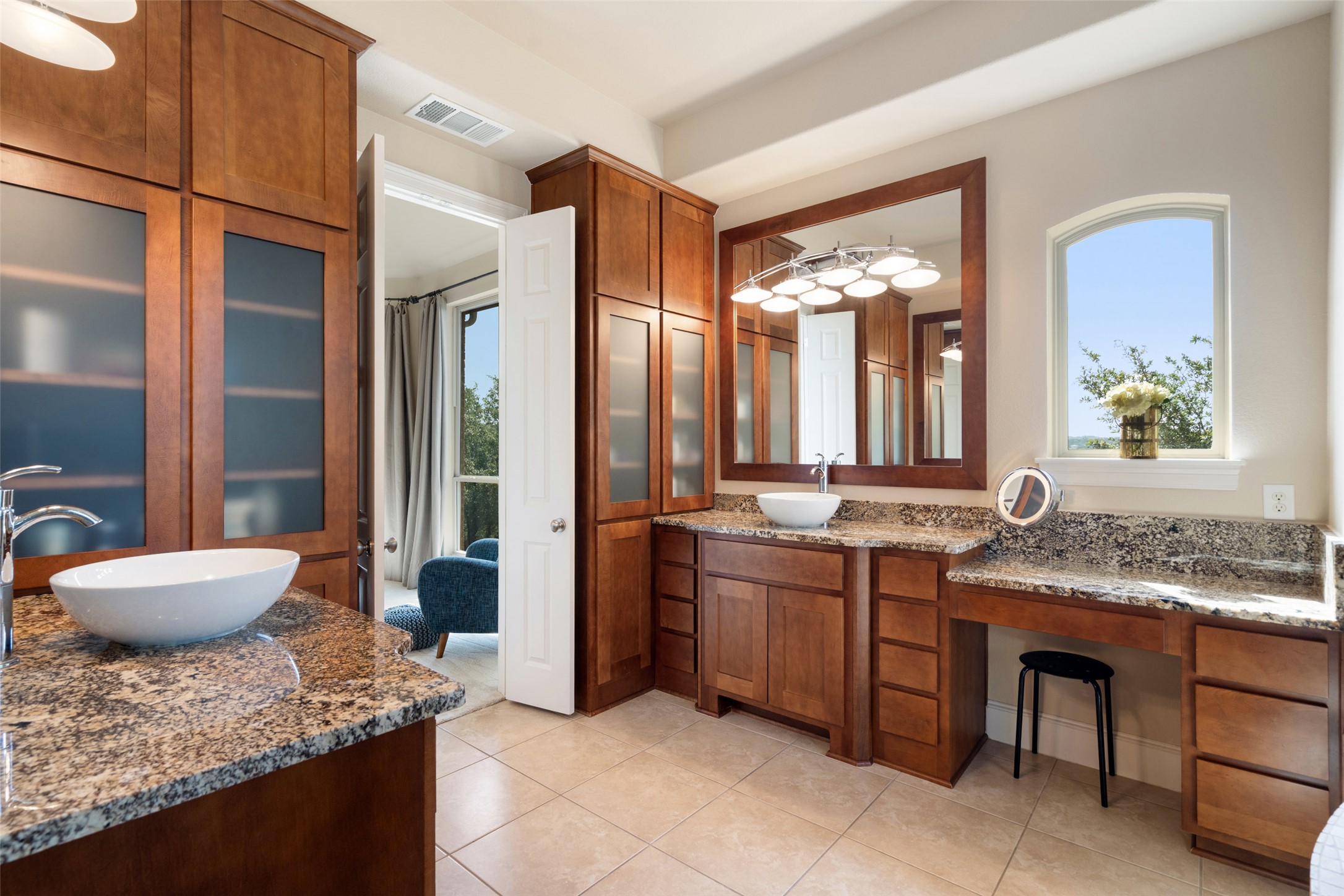 732 SANTALUZ Path Austin, TX 78732 - Photo 20 of 40 a spacious bathroom with a granite countertop sink and a mirror