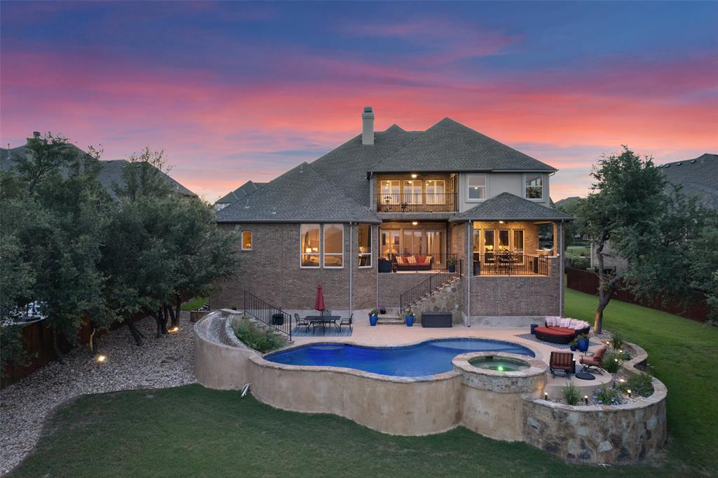 732 SANTALUZ Path Austin, TX 78732 - Photo 2 of 40 a front view of a house with a yard fire pit and outdoor seating