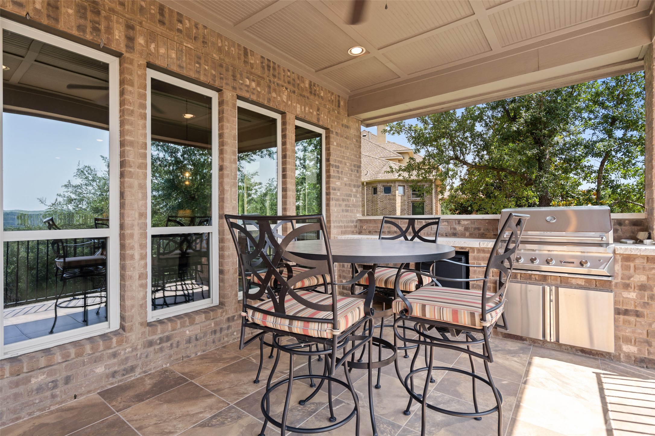 732 SANTALUZ Path Austin, TX 78732 - Photo 21 of 40 a view of an outside dining space with furniture window