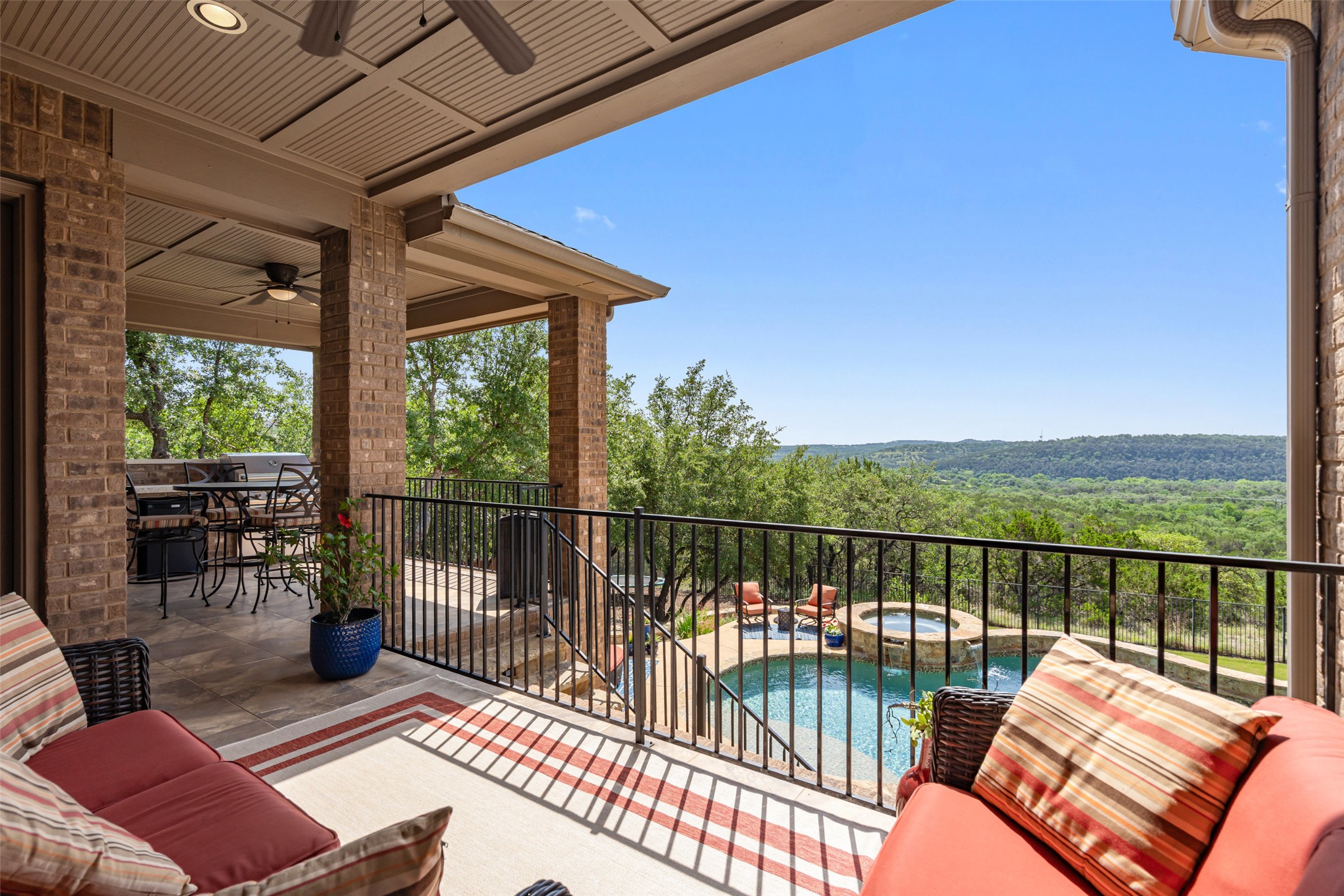 732 SANTALUZ Path Austin, TX 78732 - Photo 22 of 40 a balcony with wooden floor and outdoor seating