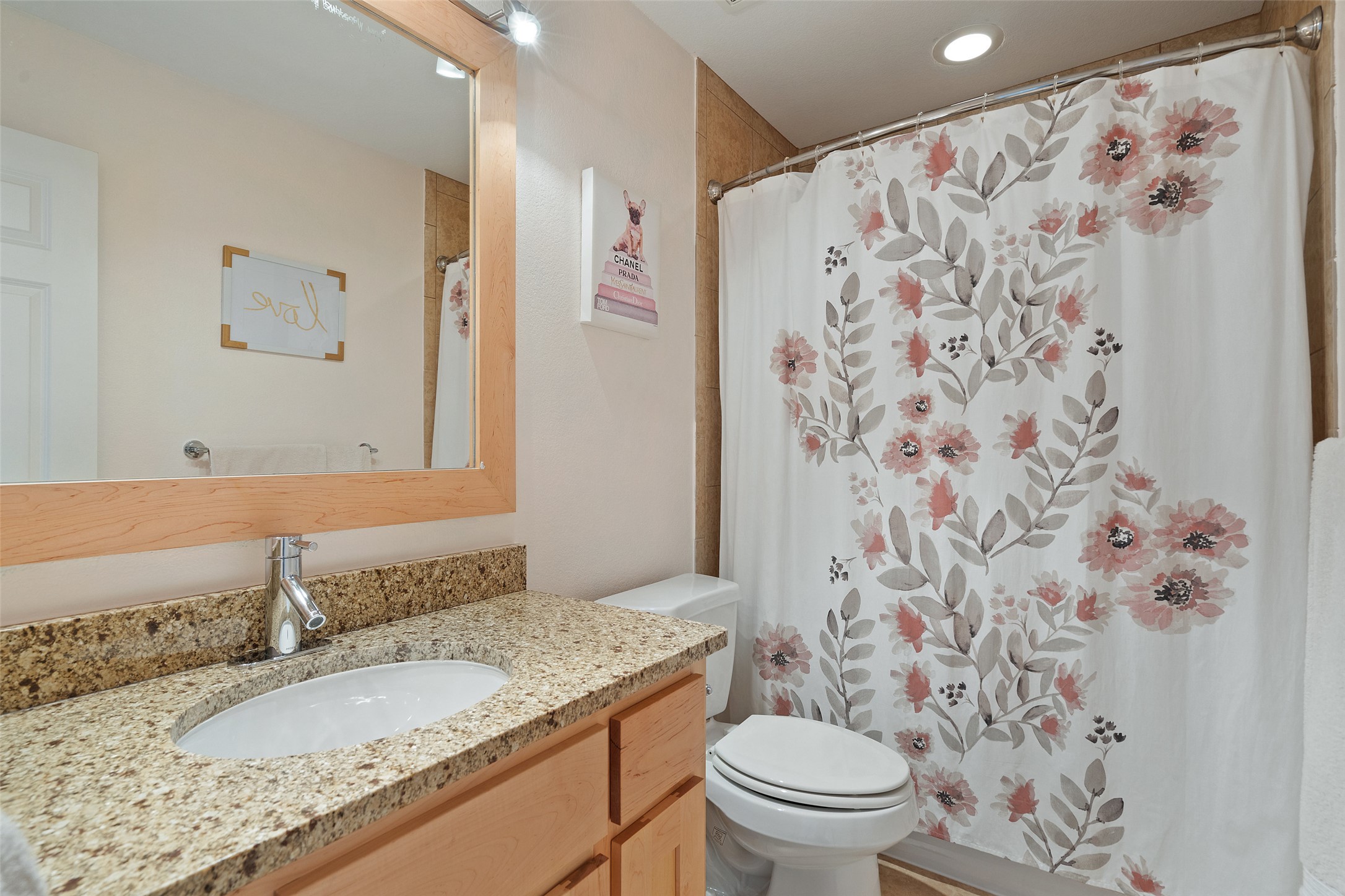 732 SANTALUZ Path Austin, TX 78732 - Photo 24 of 40 a bathroom with a granite countertop sink a toilet and a mirror