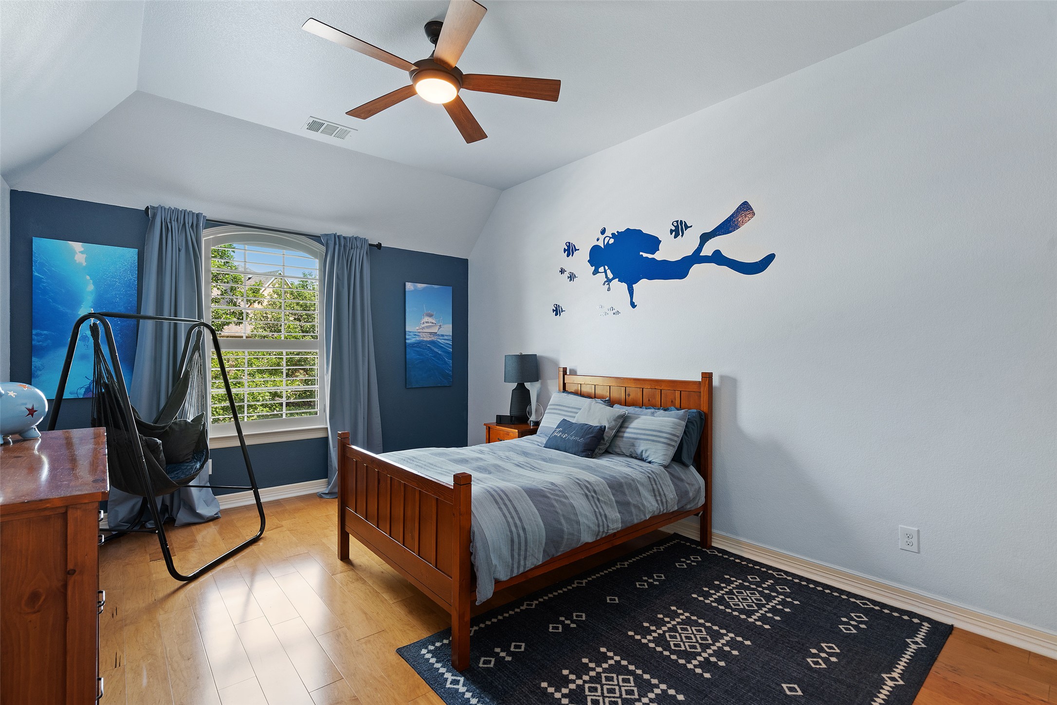 732 SANTALUZ Path Austin, TX 78732 - Photo 25 of 40 a bedroom with bed and wooden floor