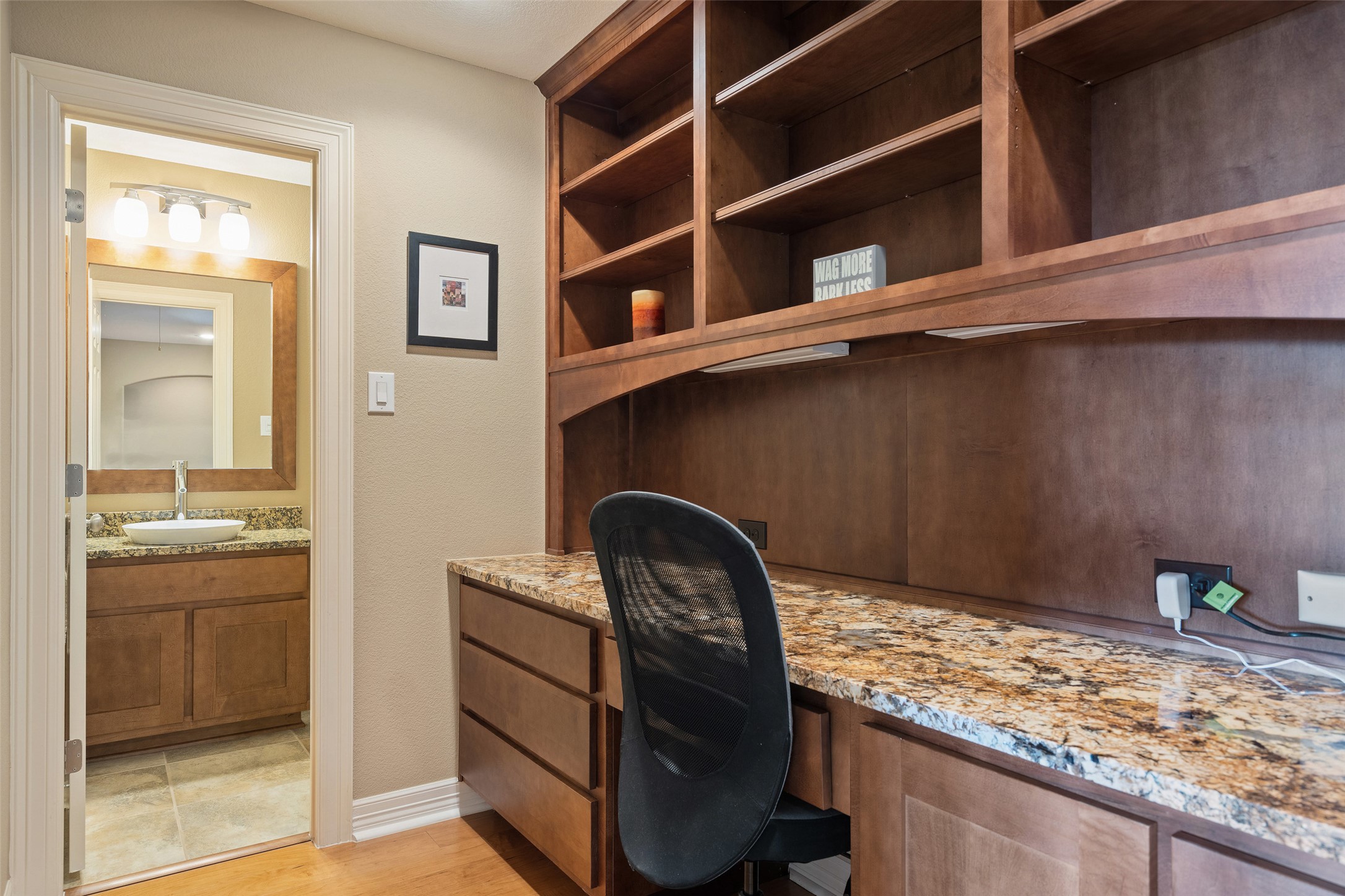 732 SANTALUZ Path Austin, TX 78732 - Photo 27 of 40 a kitchen with a granite countertop sink and stove