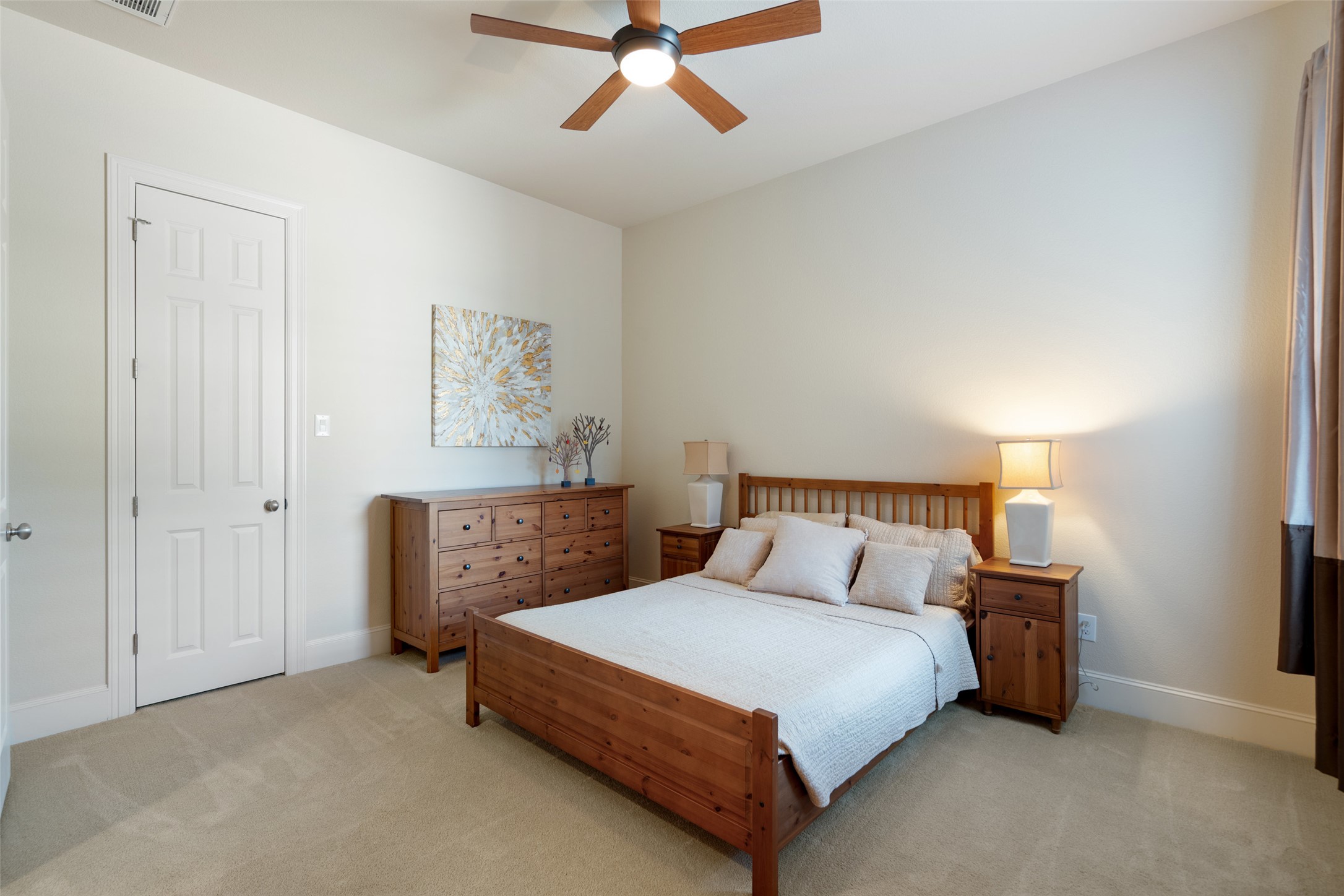 732 SANTALUZ Path Austin, TX 78732 - Photo 30 of 40 a bedroom with a bed and painting on the wall