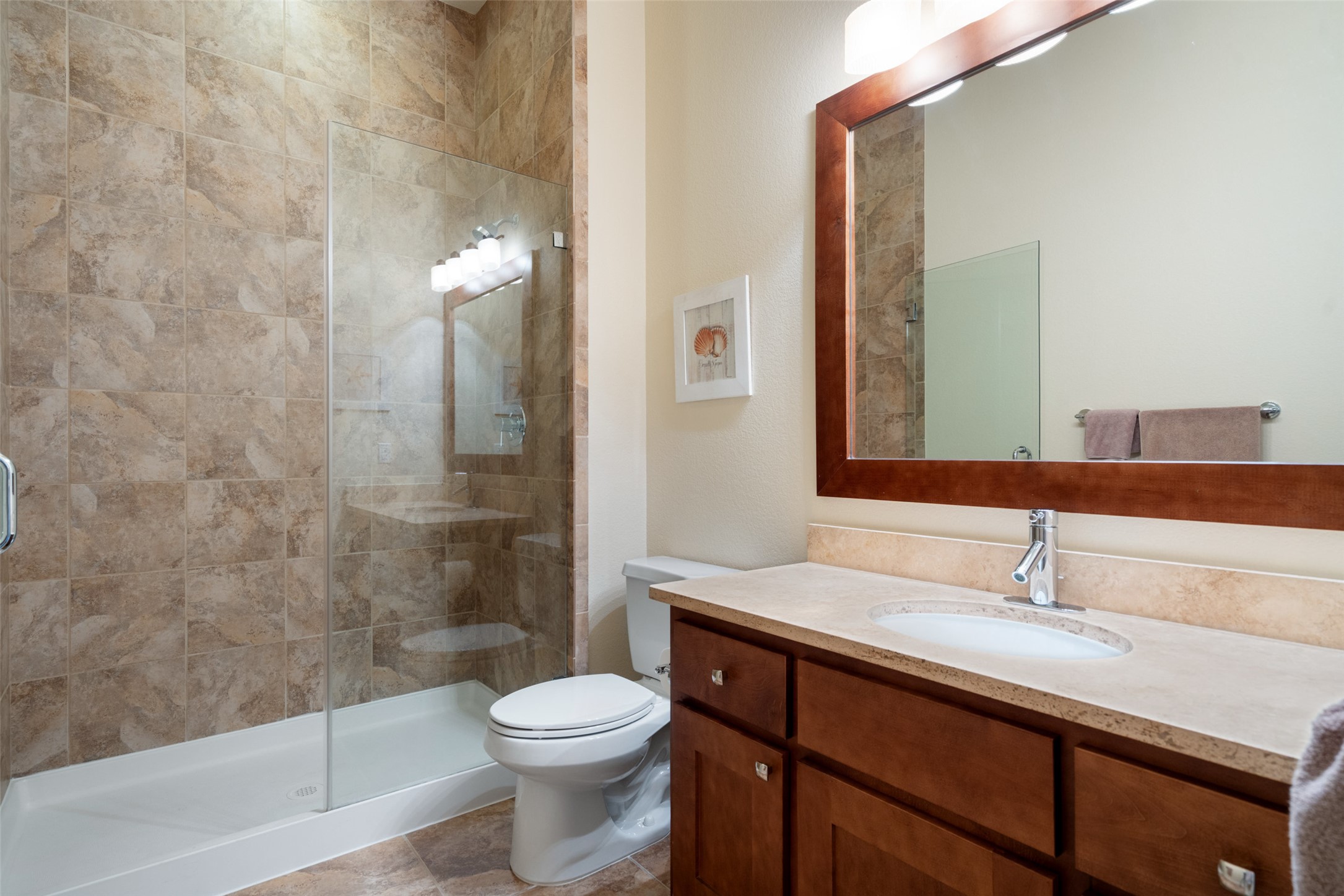 732 SANTALUZ Path Austin, TX 78732 - Photo 31 of 40 a bathroom with a sink a toilet and shower
