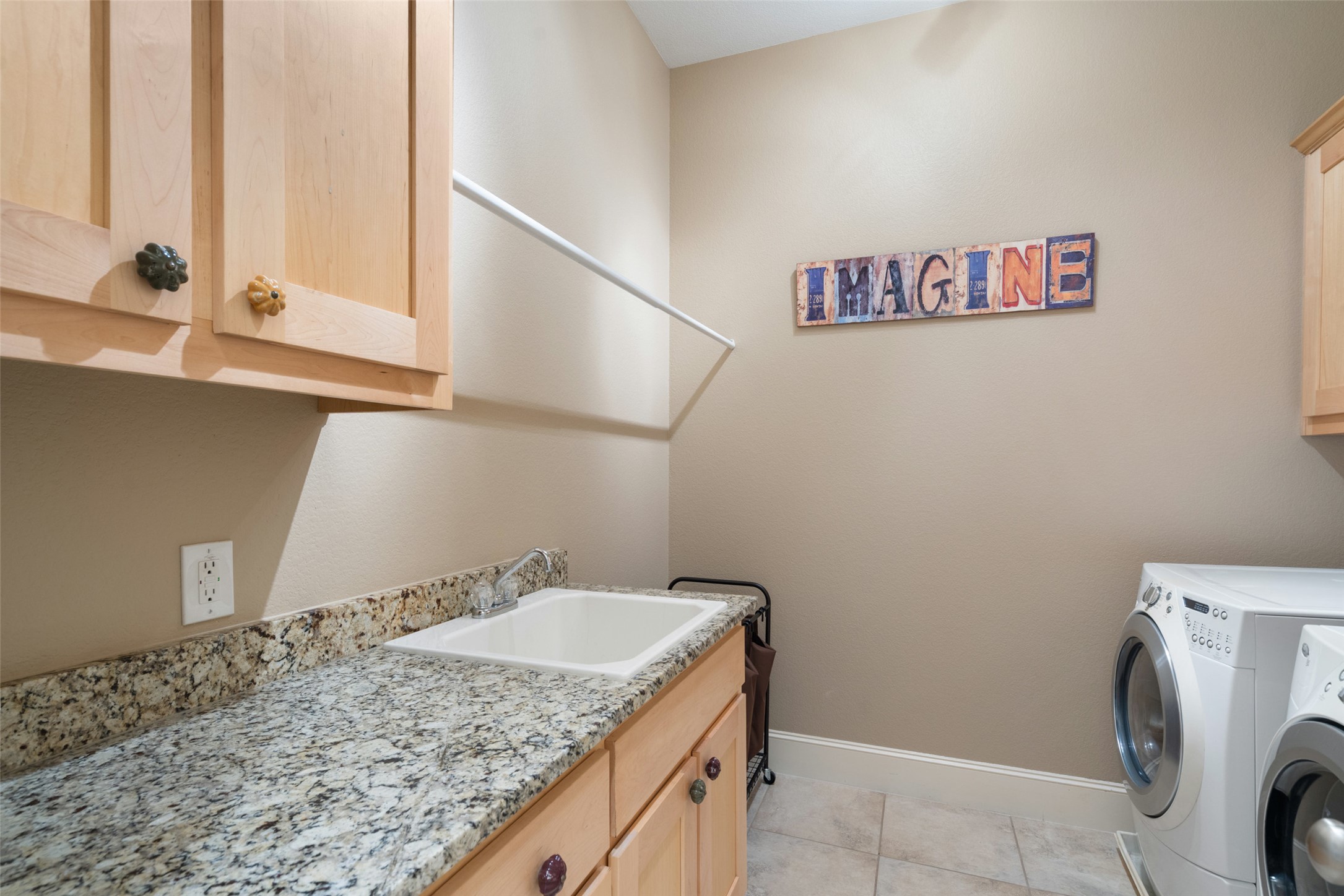 732 SANTALUZ Path Austin, TX 78732 - Photo 32 of 40 a bathroom with a granite countertop sink and a mirror