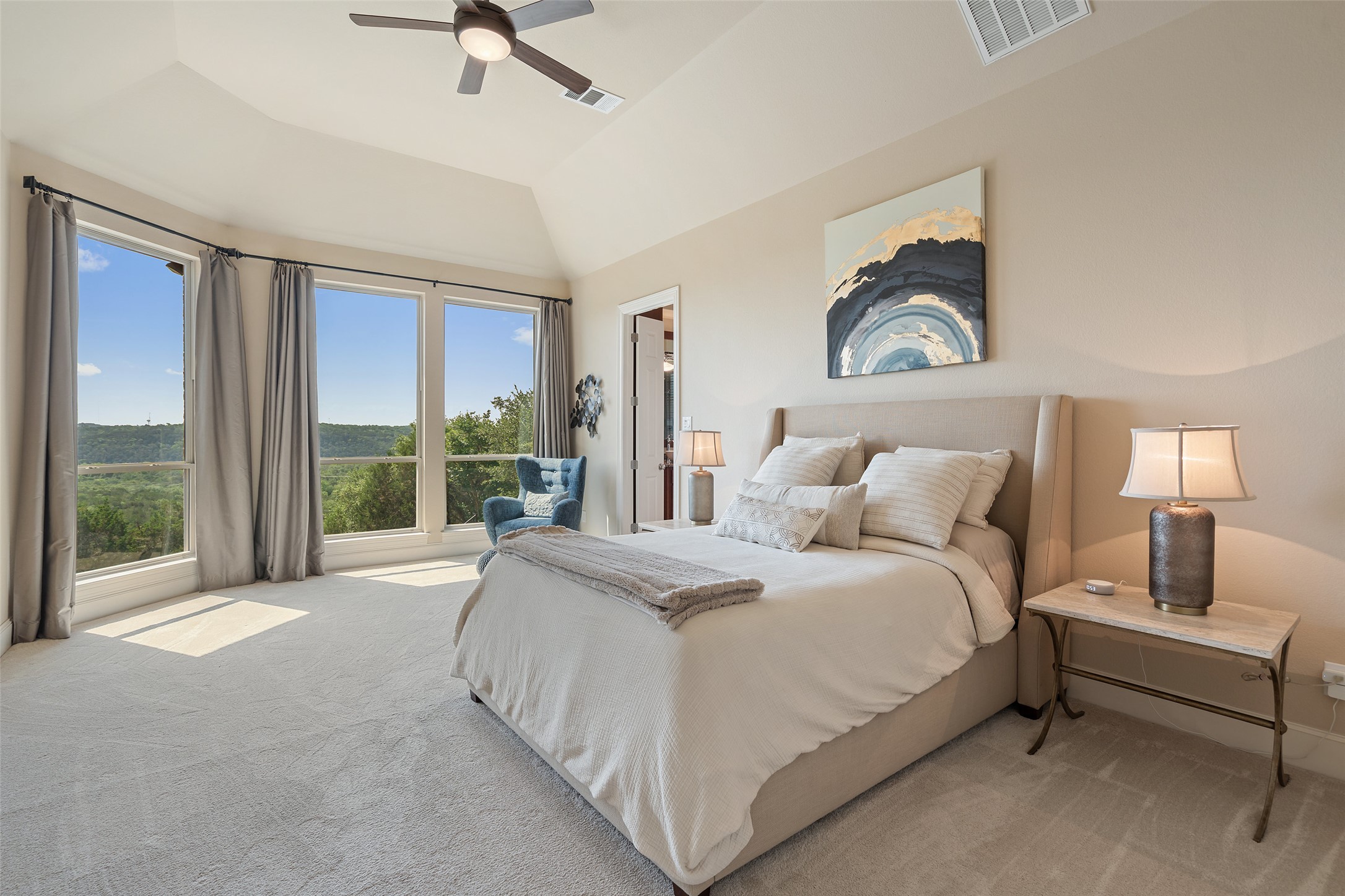 732 SANTALUZ Path Austin, TX 78732 - Photo 5 of 40 a spacious bedroom with a bed and a large window