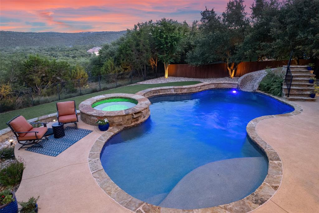 732 SANTALUZ Path Austin, TX 78732 - Photo 9 of 40 a view of a swimming pool with a patio