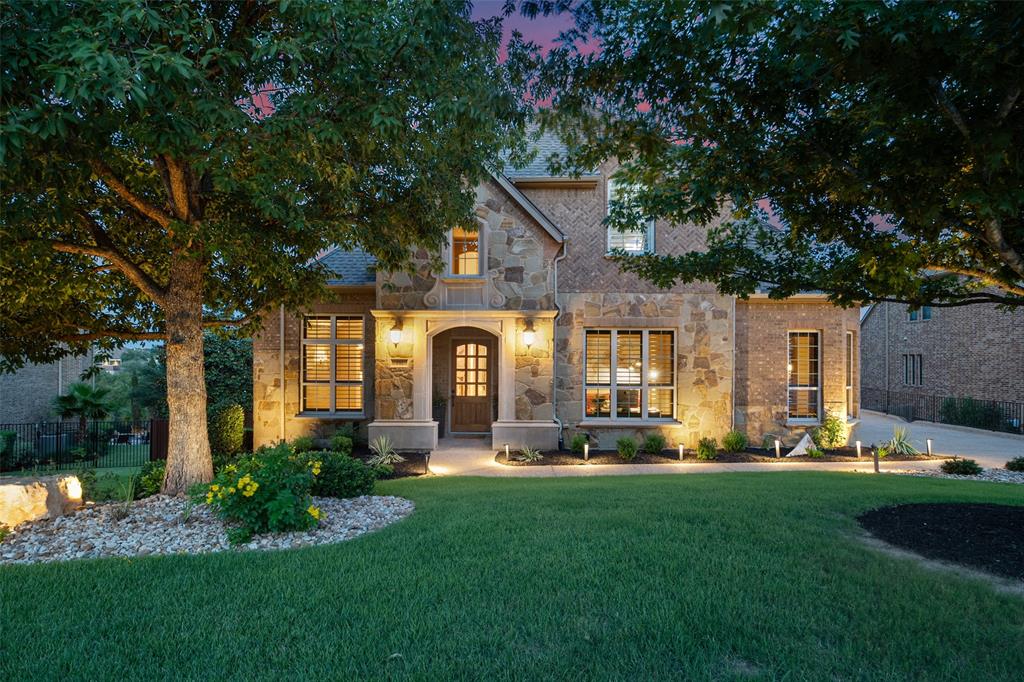 732 SANTALUZ Path Austin, TX 78732 - Photo 10 of 40 a front view of a house with a garden and trees
