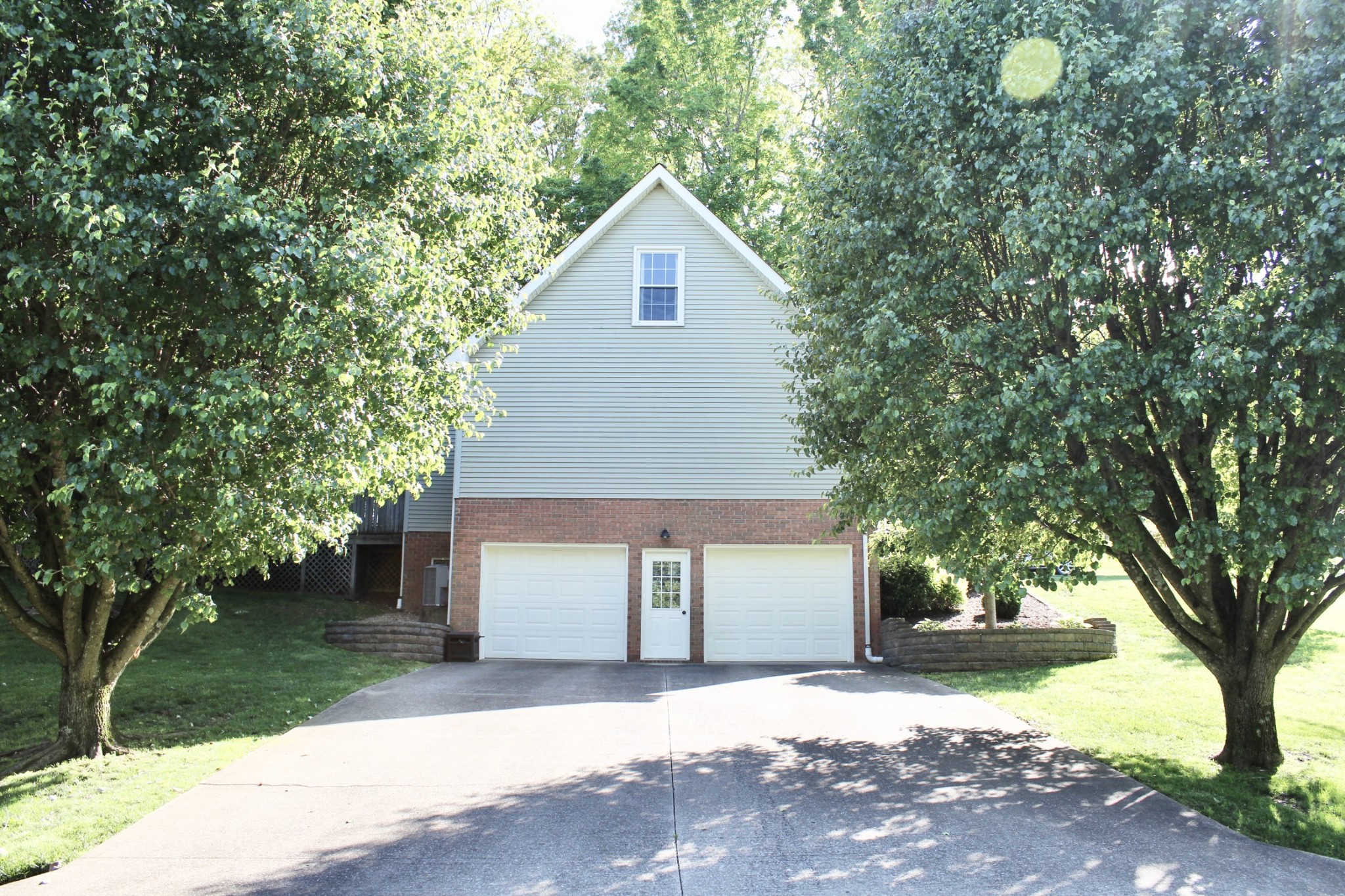 800 Oak Ridge Drive Springfield, TN 37172 - Photo 5 of 48 a front view of a house with a garden and tree