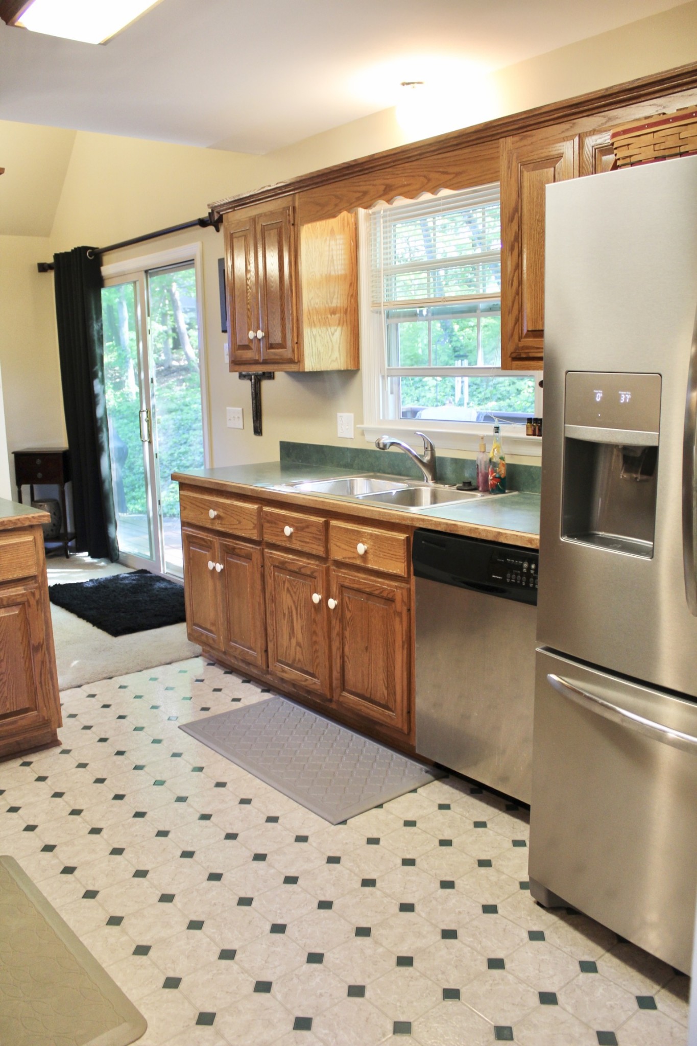 800 Oak Ridge Drive Springfield, TN 37172 - Photo 46 of 48 a kitchen with a sink a refrigerator and wooden cabinets