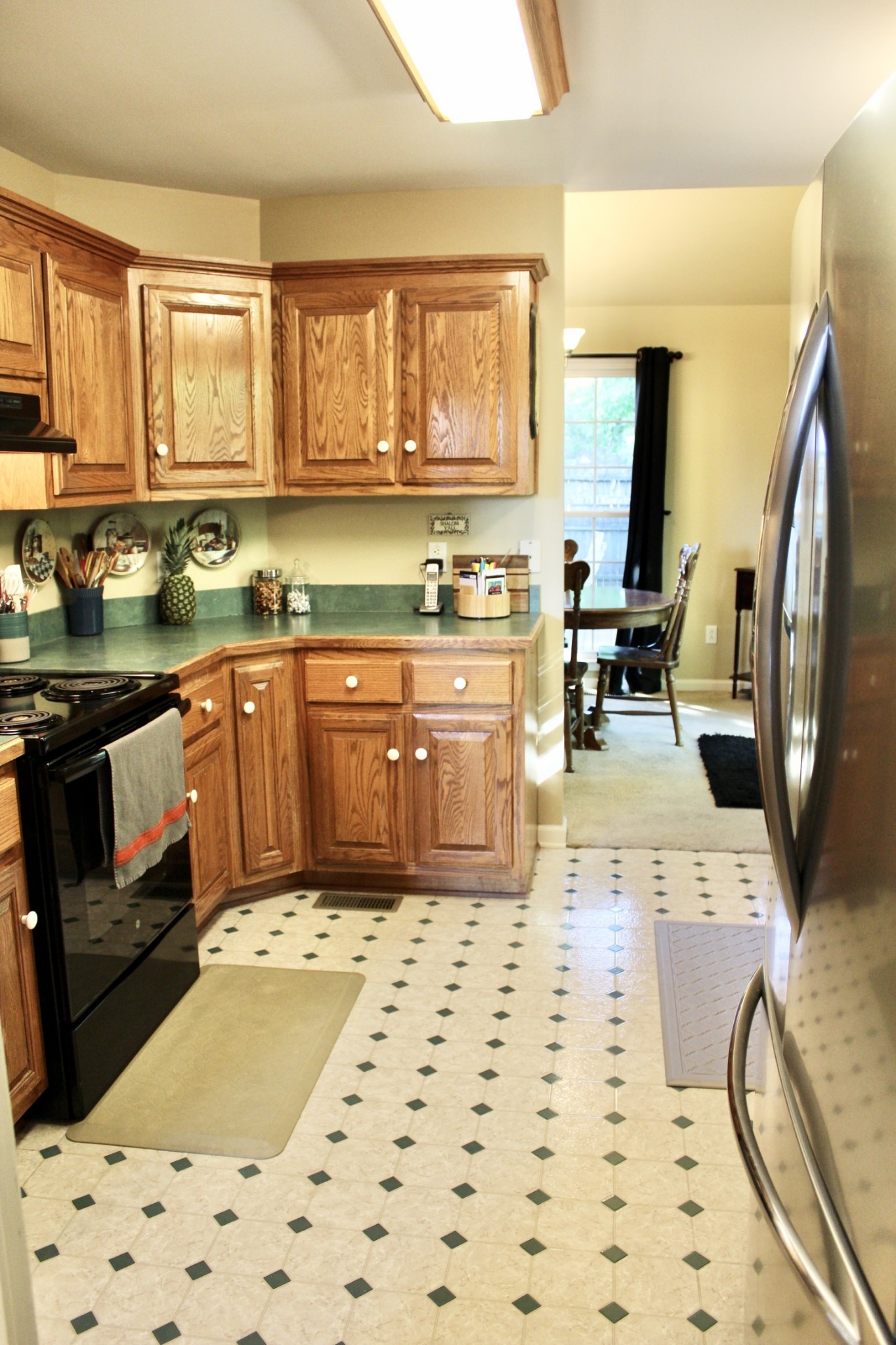 800 Oak Ridge Drive Springfield, TN 37172 - Photo 48 of 48 a kitchen with stainless steel appliances a stove a sink a refrigerator and cabinets