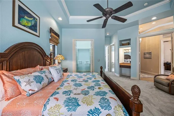 a spacious bedroom with a bed and a couch