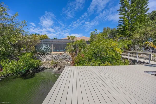 a view of a lake with a deck and a patio