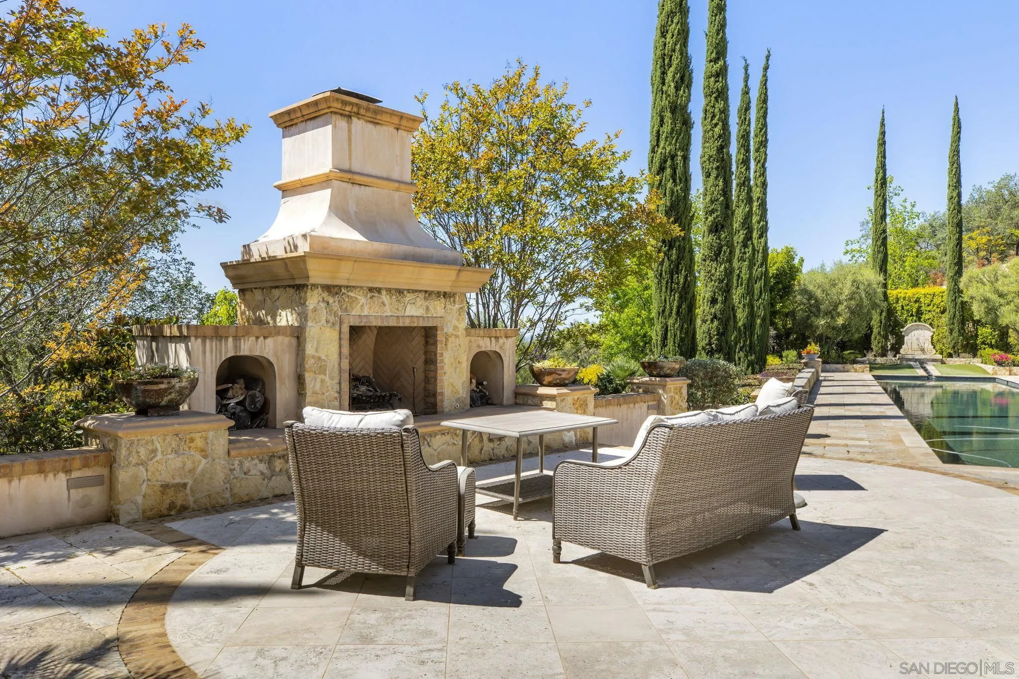 14440 Ridge Ranch Road Valley Center, CA 92082 - Photo 65 of 73 a view of a patio with couches table and chairs and potted plants