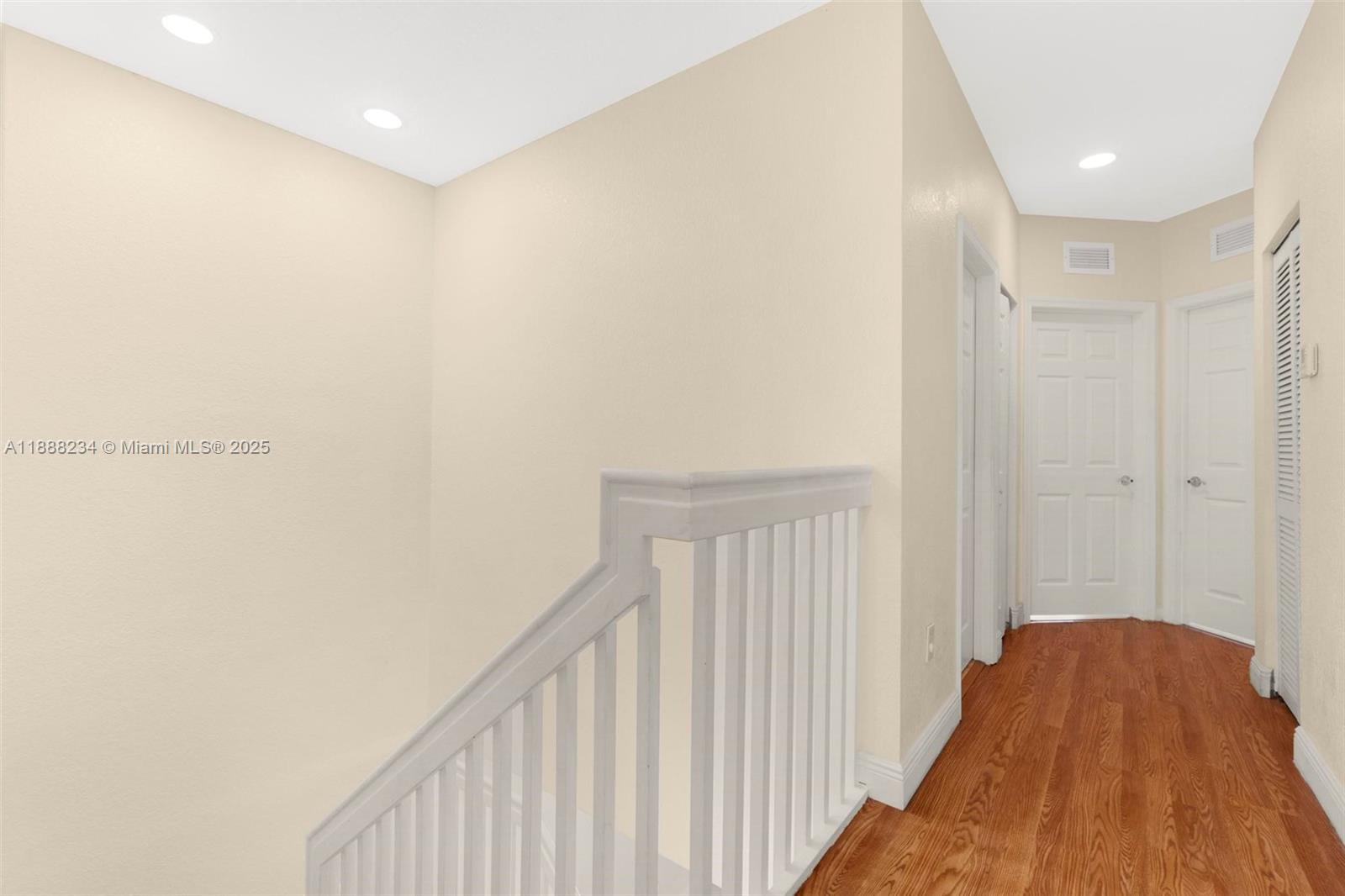 2508 Southwest 85th Terrace, Unit 105 Miramar, FL 33025 - Photo 13 of 27 a view of a hallway with wooden floor