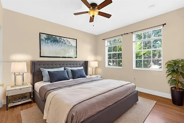 a bedroom with bed and window