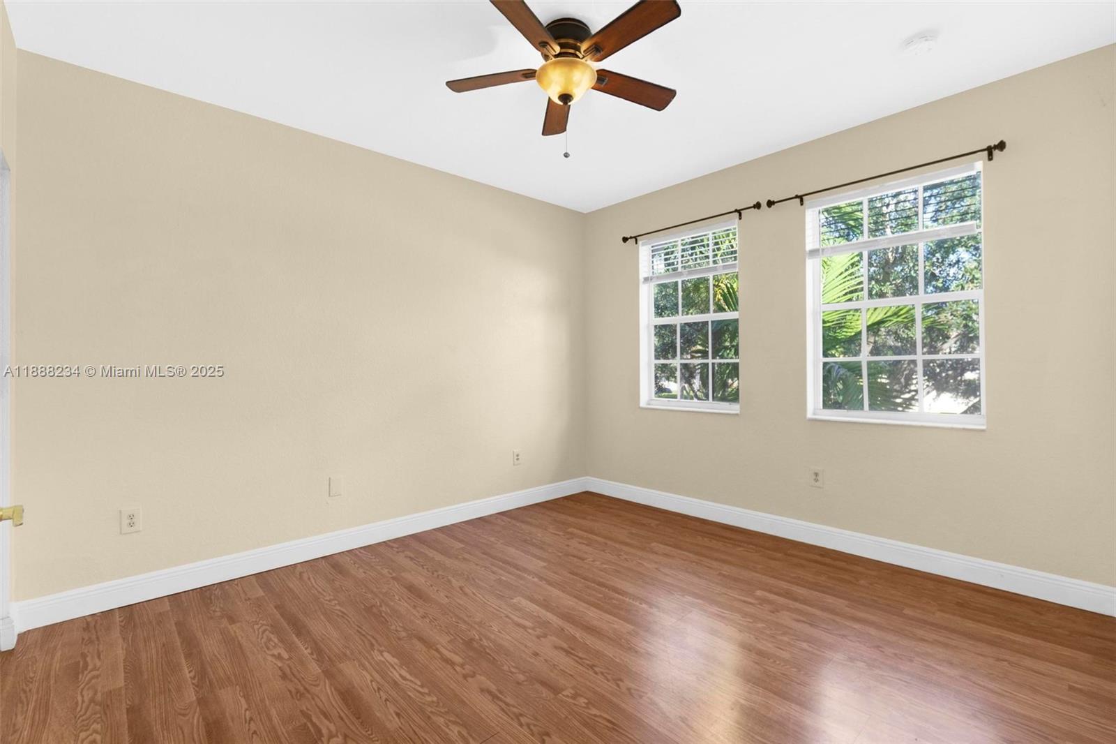 2508 Southwest 85th Terrace, Unit 105 Miramar, FL 33025 - Photo 19 of 27 a view of a room with wooden floor and windows