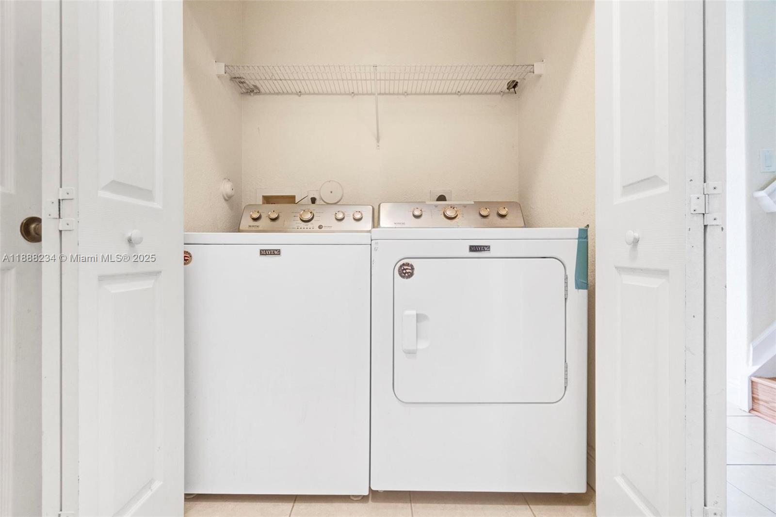 2508 Southwest 85th Terrace, Unit 105 Miramar, FL 33025 - Photo 25 of 27 a utility room with dryer and washer